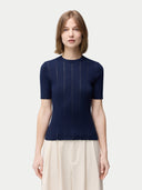 Women's Lace-Knit Cashmere Silk Top Mood Indigo worn by model, detail view on white backround #color_dark-indigo