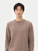 Men's Taupe Crewneck Cashmere Sweater worn by model, detail view on white background #color_taupe #ai-image