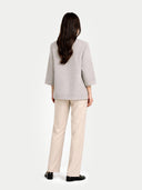 Women's Patch Pocket Cashmere Poncho Jacket Dawn Blue worn by model back view on white background #color_steel-silver #ai-image