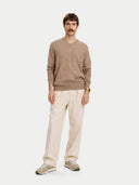 Men's Taupe Cashmere V-Neck Sweater worn by model, front view on white background #color_taupe #ai-image