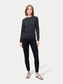 Women's Silk Cashmere Leggings Black worn by model, front view on white background #color_graphite-black