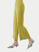 Women's Rib-Knit Silk Cashmere Blend Pants Dark Citron worn by model, side view on white background #color_dark-citron