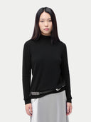 Essential Cashmere Mock Neck Sweater Black worn by model, detail view, on white background #color_black