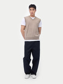 Men‚Äôs taupe cashmere vest worn by model, front view, on white background #color_taupe