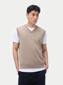 Men‚Äôs taupe cashmere vest worn by model, detail view, on white background #color_taupe