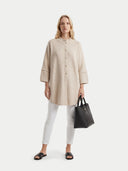 Women's Beige Cashmere Button-Front Poncho worn by model, front view on white background #color_beige