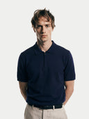 Men's Navy Cashmere Silk Half-Zip Polo Top worn by model, detail view on white background #color_dark-indigo #ai-image