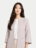 Women's Patch Pocket Cashmere Poncho Jacket Dawn Blue worn by model detail view on white background #color_steel-silver #ai-image