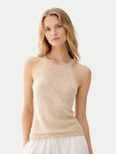 Woman wearing a beige sleeveless cashmere top against a light background. #color_beige #ai-image