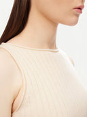 close up of a white ribbed sleeveless crew neck top #color_off-white