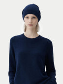 Person wearing a navy blue sweater and headscarf on a white background #color_navy-blue #ai-image