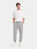 Men's Cashmere Jogger Light Gray worn by model, front view on white background #color_urban-silver #ai-image