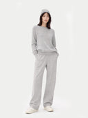 Person wearing a grey outfit on a white background #color_urban-silver #ai-image