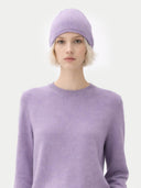 99 Cashmere Hat & Sweater Set Purple worn by model, detail view on white background #color_ash-purple #ai-image