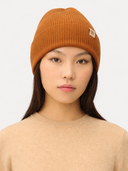 Bone Brown Cashmere Rib Knit Beanie worn by model, front view on white background #color_warm-tan